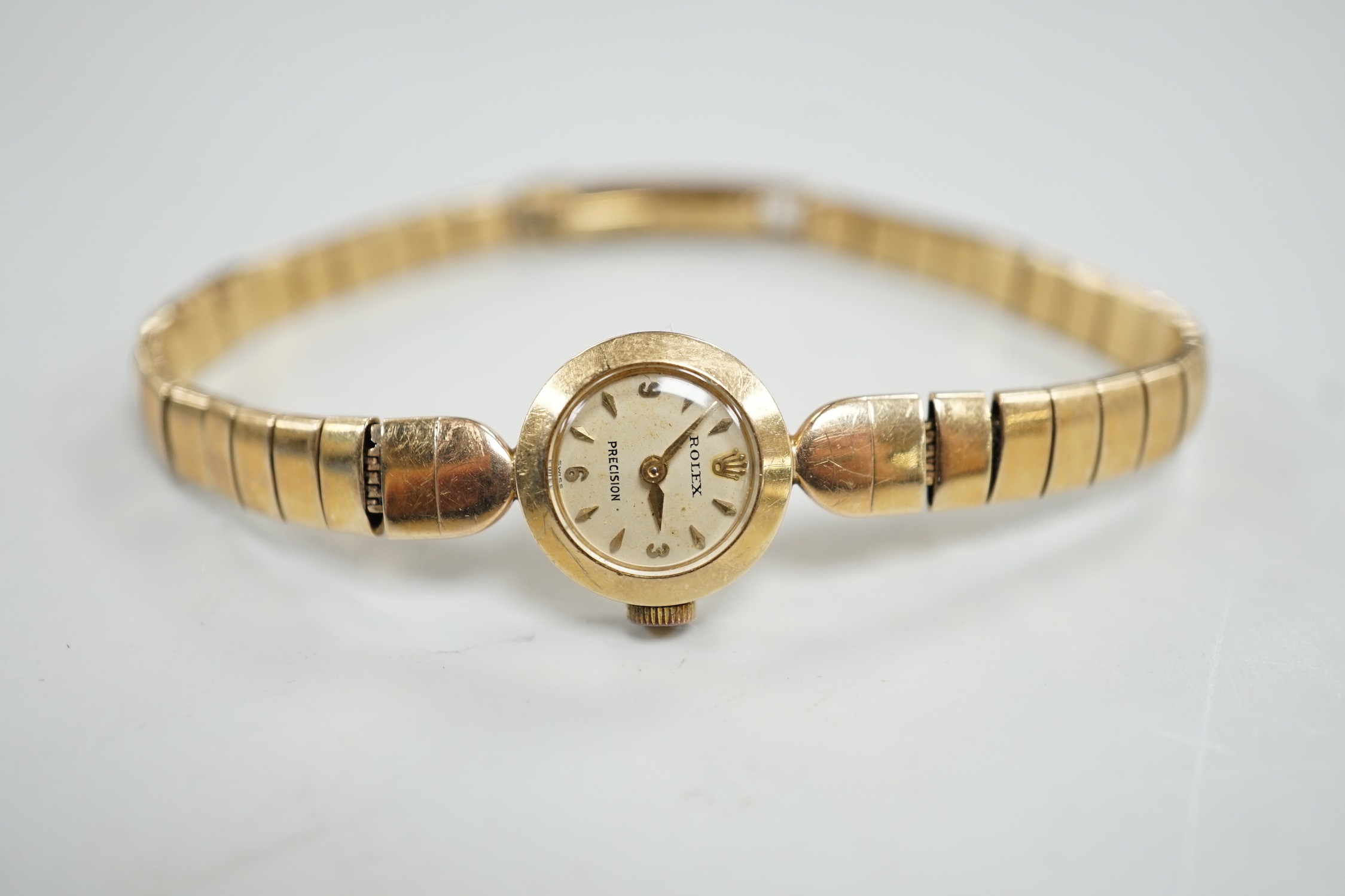 A lady's 9ct gold Rolex Precision manual wind wrist watch, on 9ct gold Rolex bracelet, case diameter 16mm, gross weight 16.8 grams, with Rolex box.